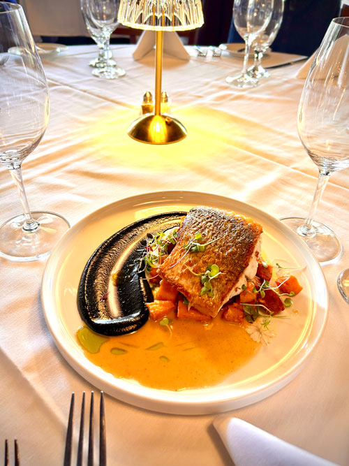 Cobia and Andouille Sausage with Squid Ink Calamata Olives Puree Cobia and Andouille Sausage with Squid Ink Calamata Olives Puree